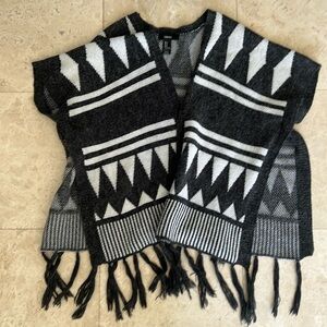Dark gray and white poncho with tassels